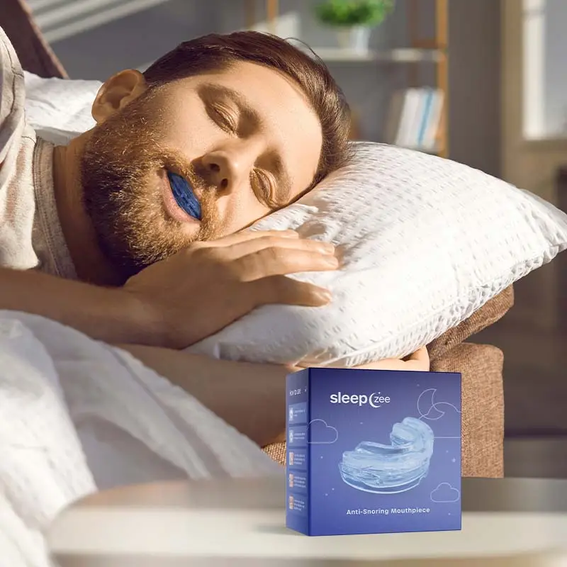 Image showing a man sleeping on his side with Sleep Zee Sleep Zee Mouthpiece in his mouth